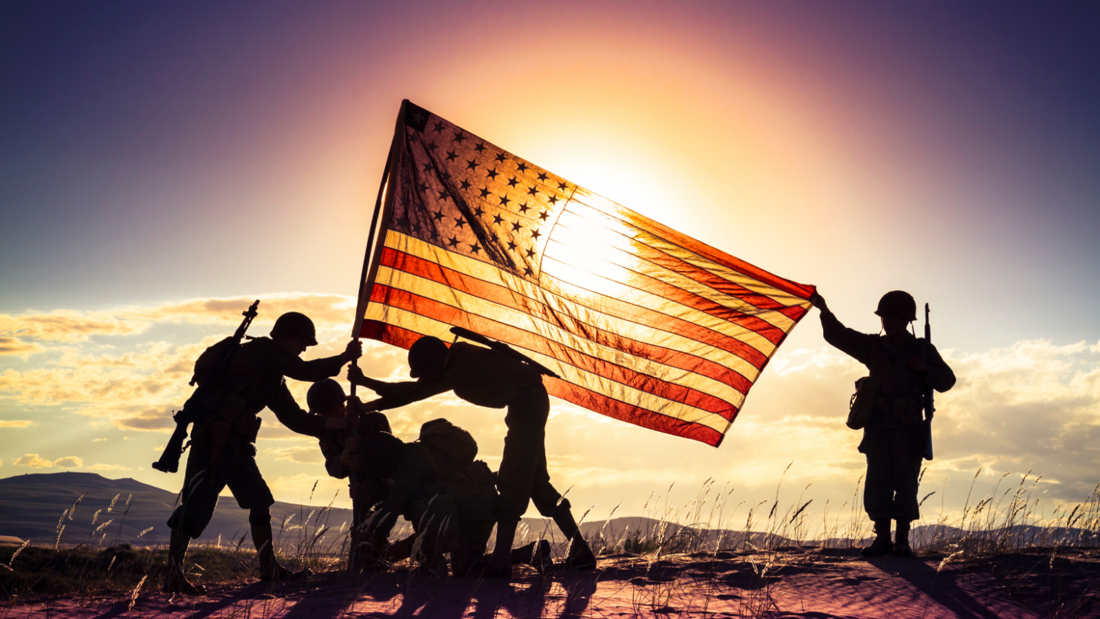 Soldiers setting up US flag